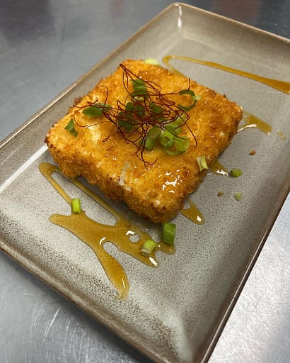 Have you tried the Fried Feta yet??

Panko crusted fried feta with a hot honey glaze, scallions and chili 🌶 threads on top! 

Open at 5pm!